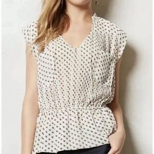 Anthropologie cap sleeve, pleated peplum blouse from the brand ISANI. Size 4.